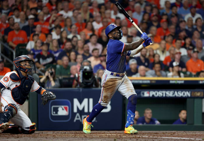 Oct 23, 2023; Houston, Texas, USA; Texas Rangers right fielder Adolis Garcia (53) hits a home run during the third inning of game seven in the ALCS against the Houston Astros for the 2023 MLB playoffs at Minute Maid Park. Mandatory Credit: Thomas Shea-USA TODAY Sports